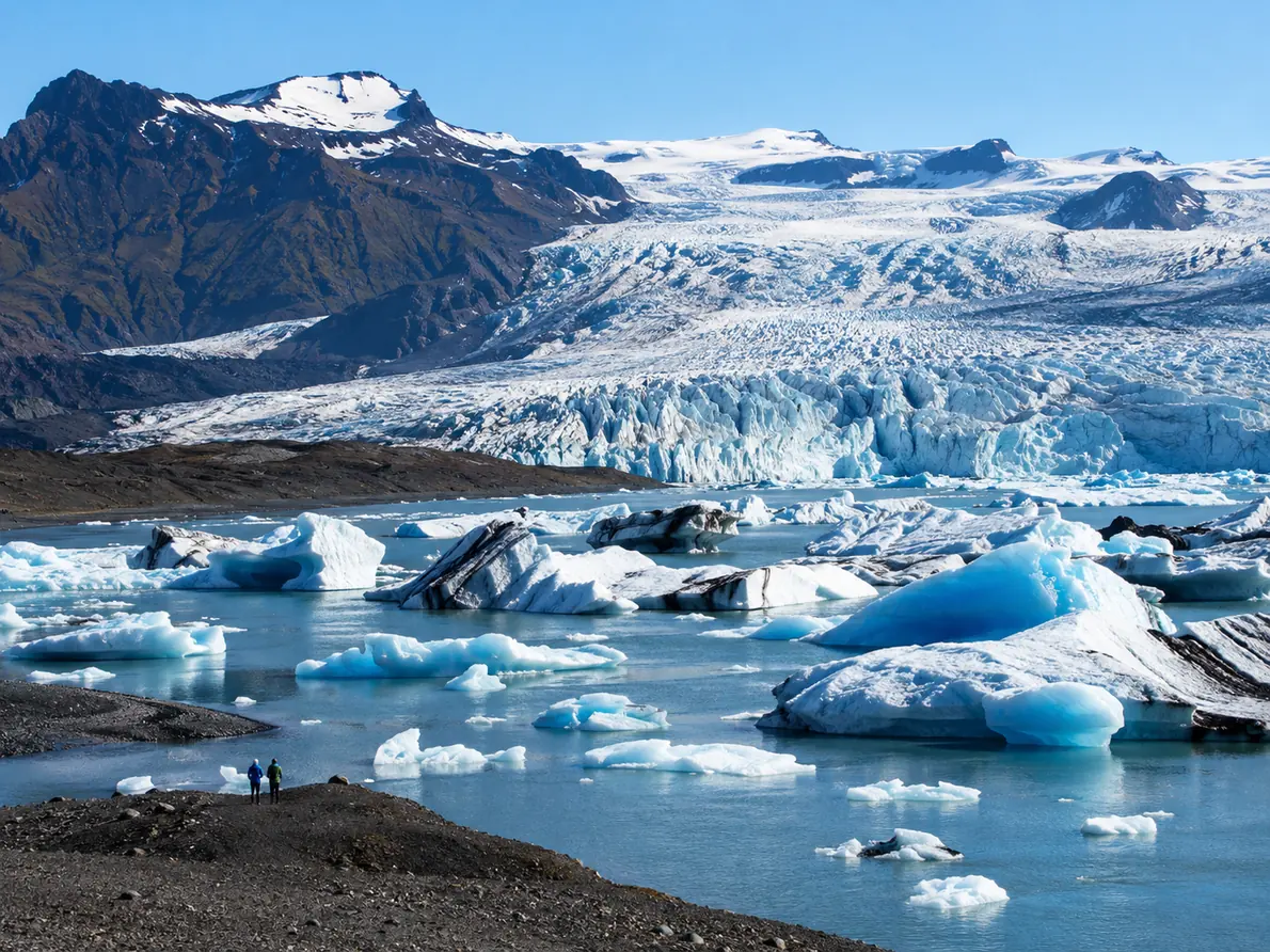 Seracs and ice towers on a glacier face above a lagoon