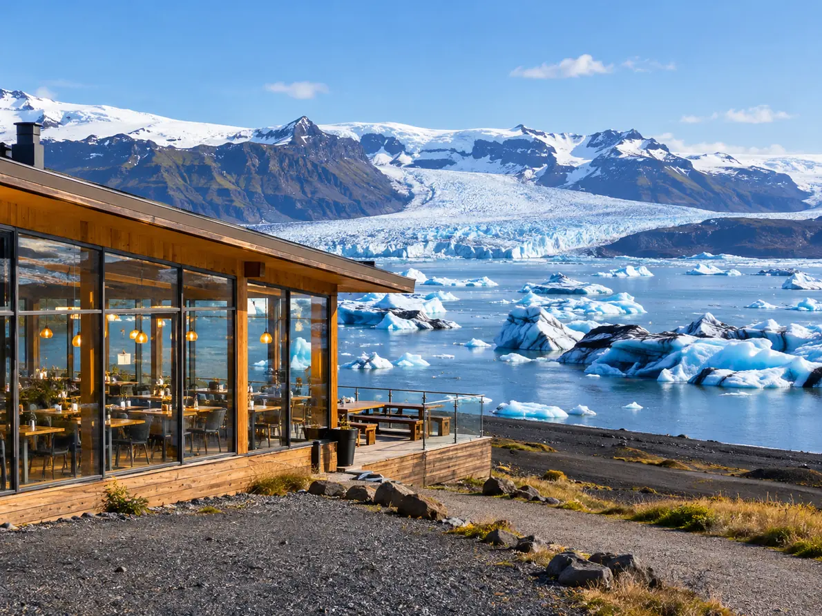 A low restaurant building beside a glacier lagoon